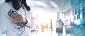 Doctor With Stethoscope and hospital in background